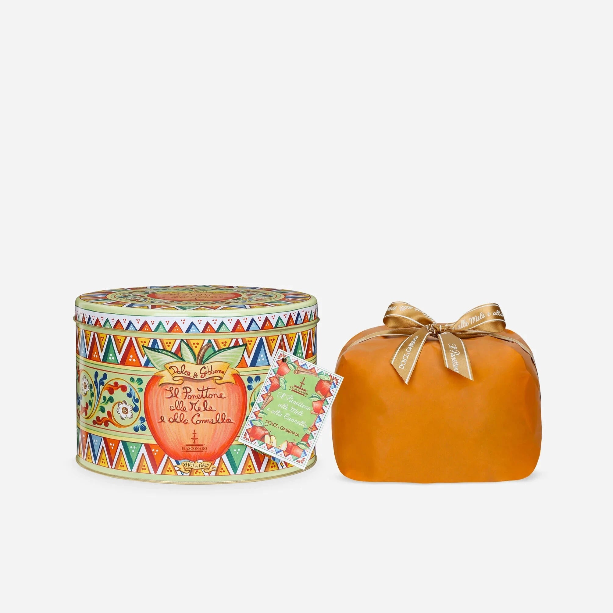 Decorative pumpkin with a colorful tin container on a white background