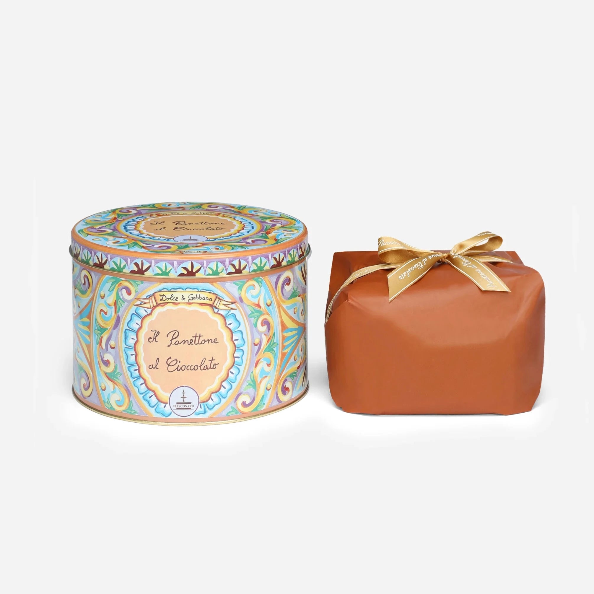 Decorative tin and brown box with a bow on a white background
