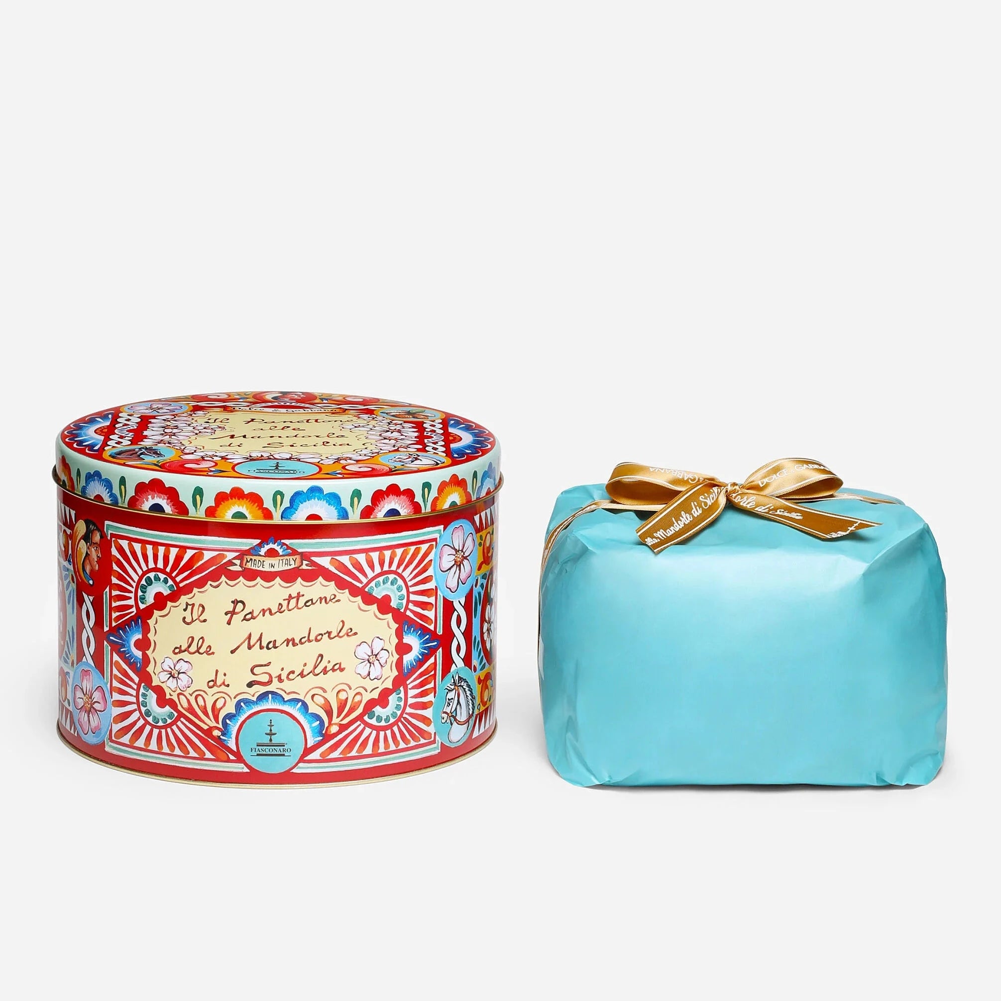 Decorative tin can and turquoise box with gold bow on a white background