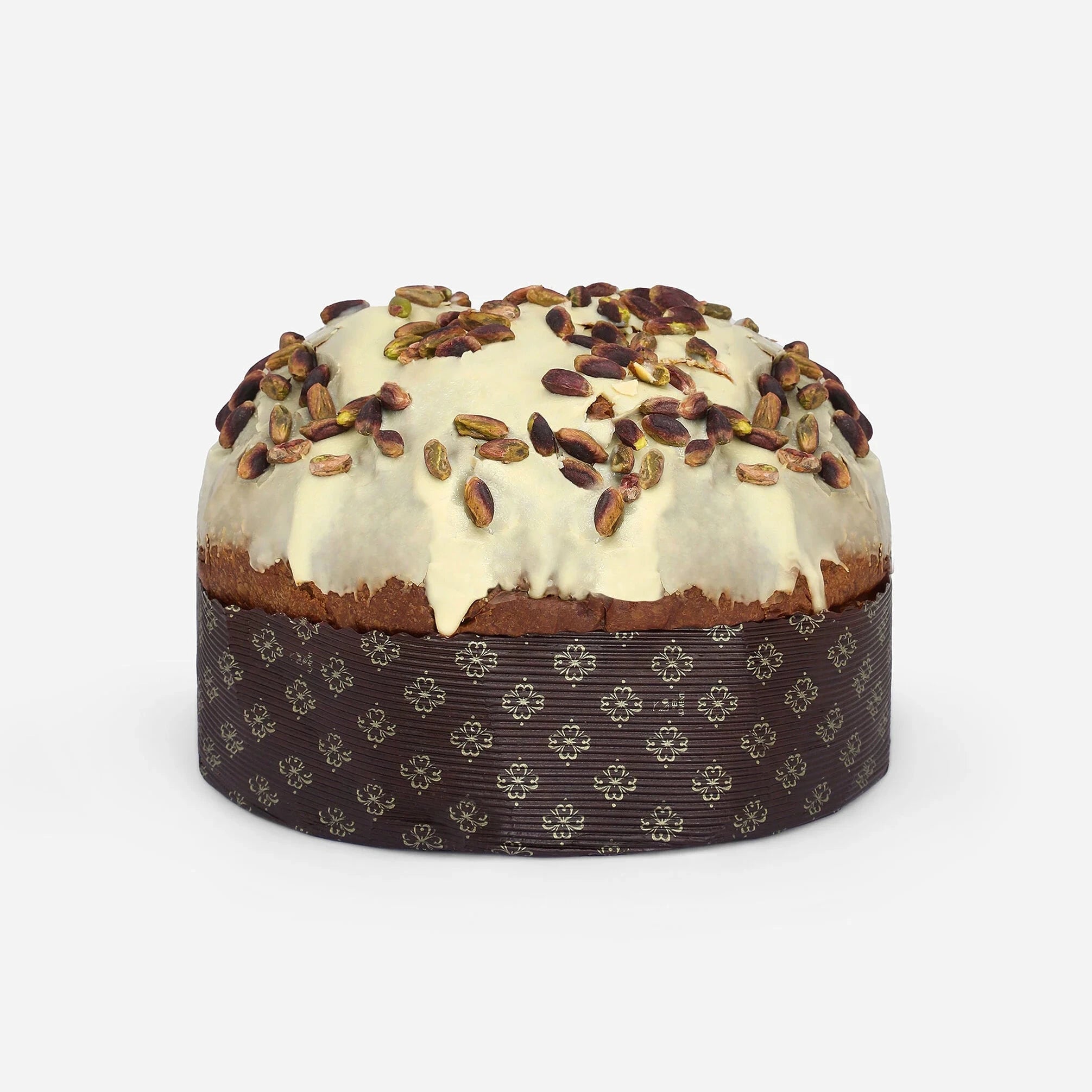 Round cake with white frosting and pecans on a white background